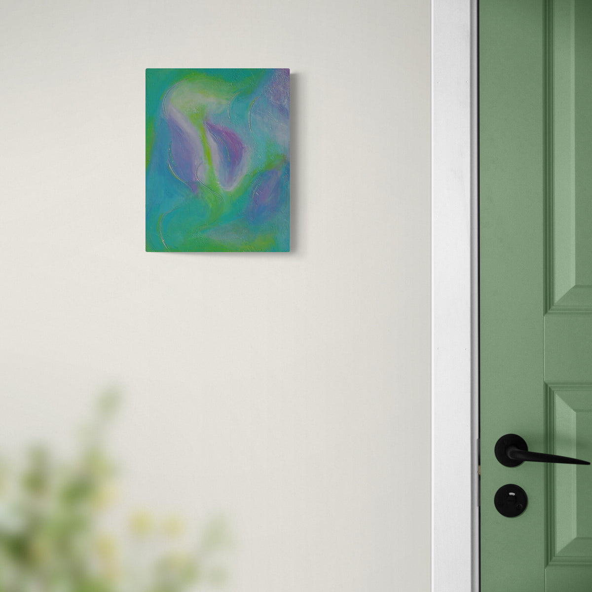 Abstract floral painting with teal, green, and purple tones displayed on a white wall next to a green door.